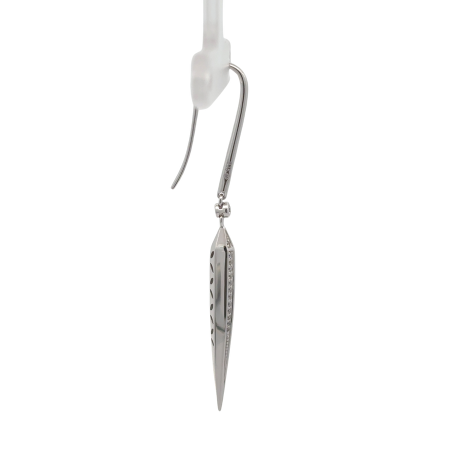 Close-up of elegant long silver earrings for women