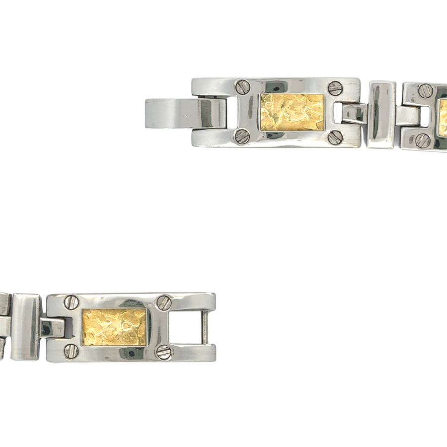 Man wearing 18k gold and titanium bracelet with formal attire