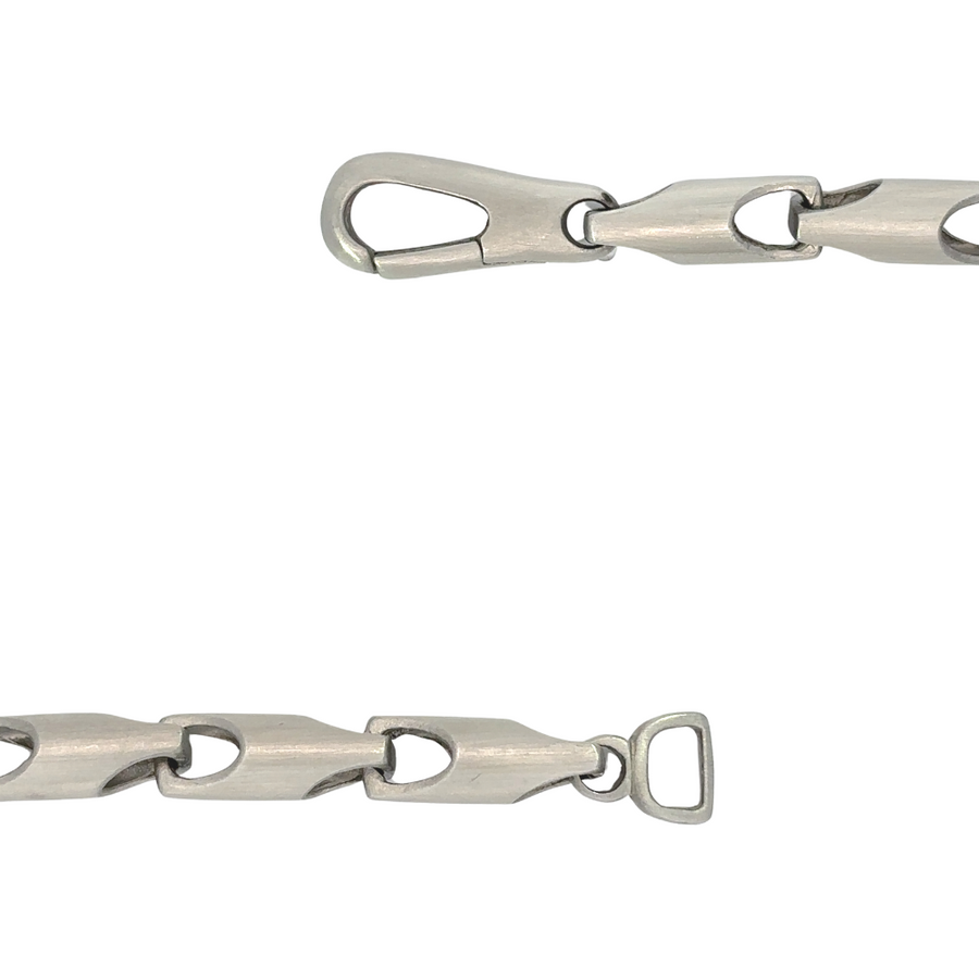 Close-up of polished stainless steel chain for men