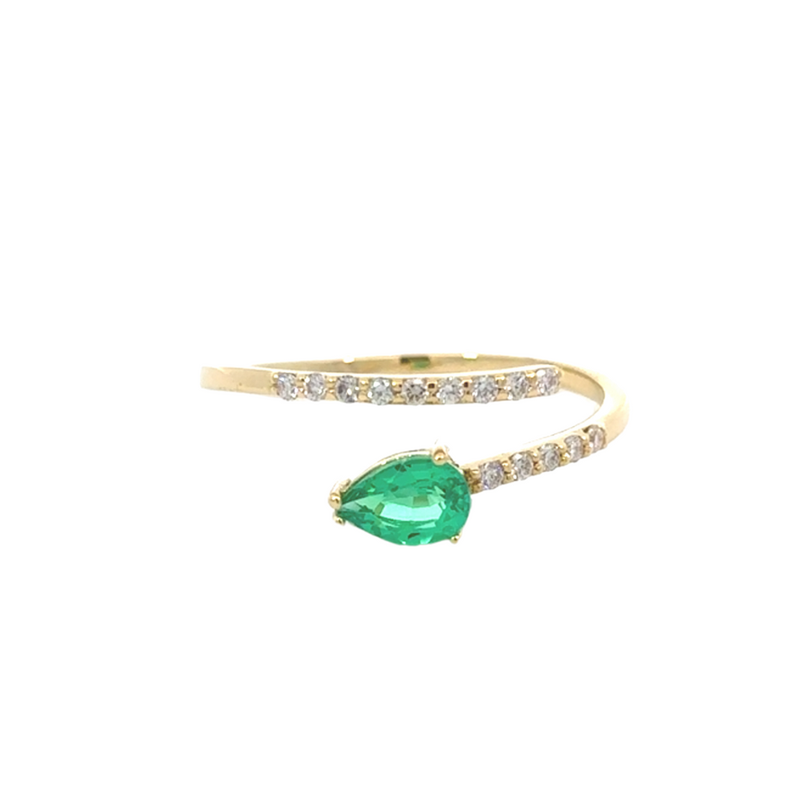 Modern open ring design in gold with emerald