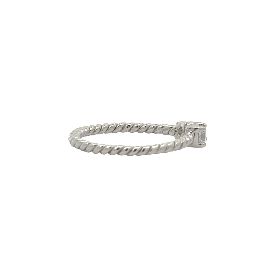 Close-up of CZ stones embedded in silver rope ring