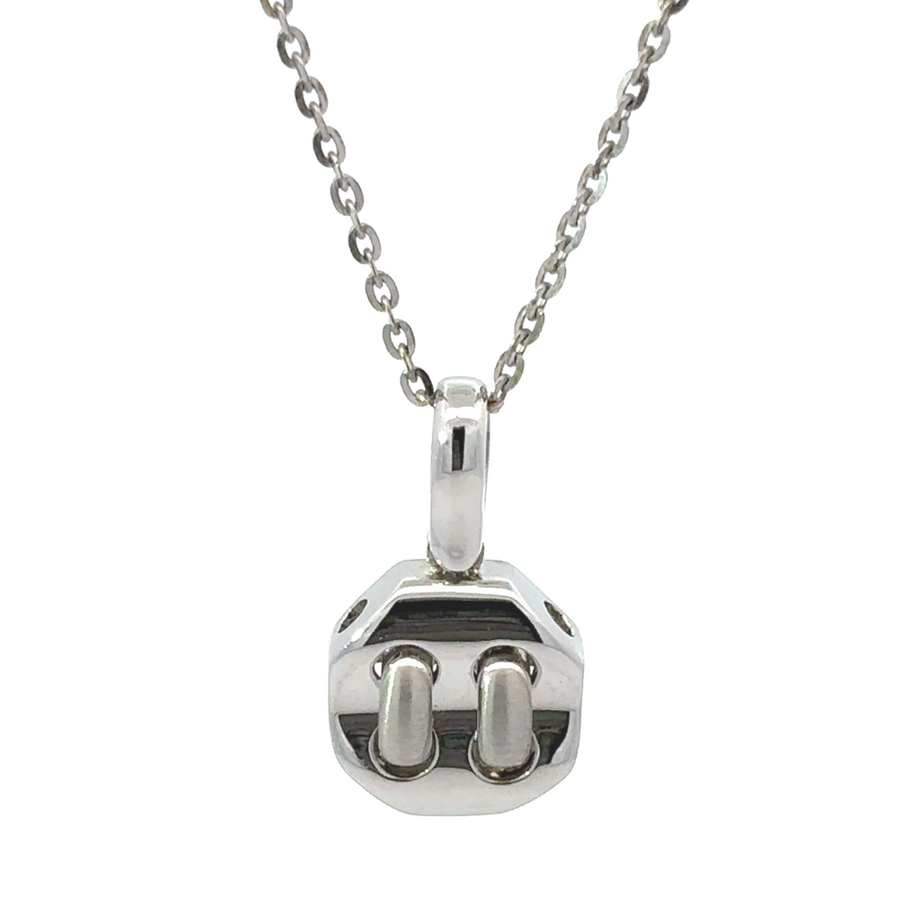 Close-up of small white gold pendant on neutral background