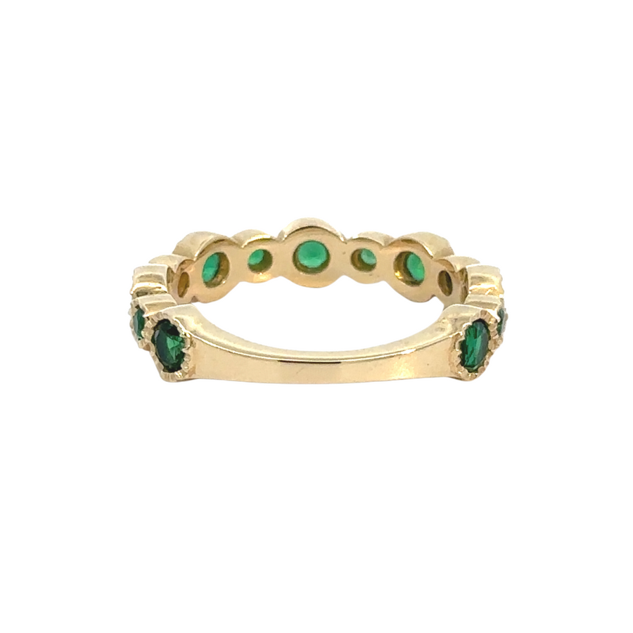 Woman wearing green CZ ring as a statement piece