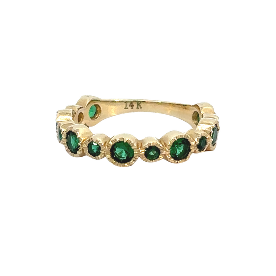 14k gold ring with vibrant green CZ stone on white background