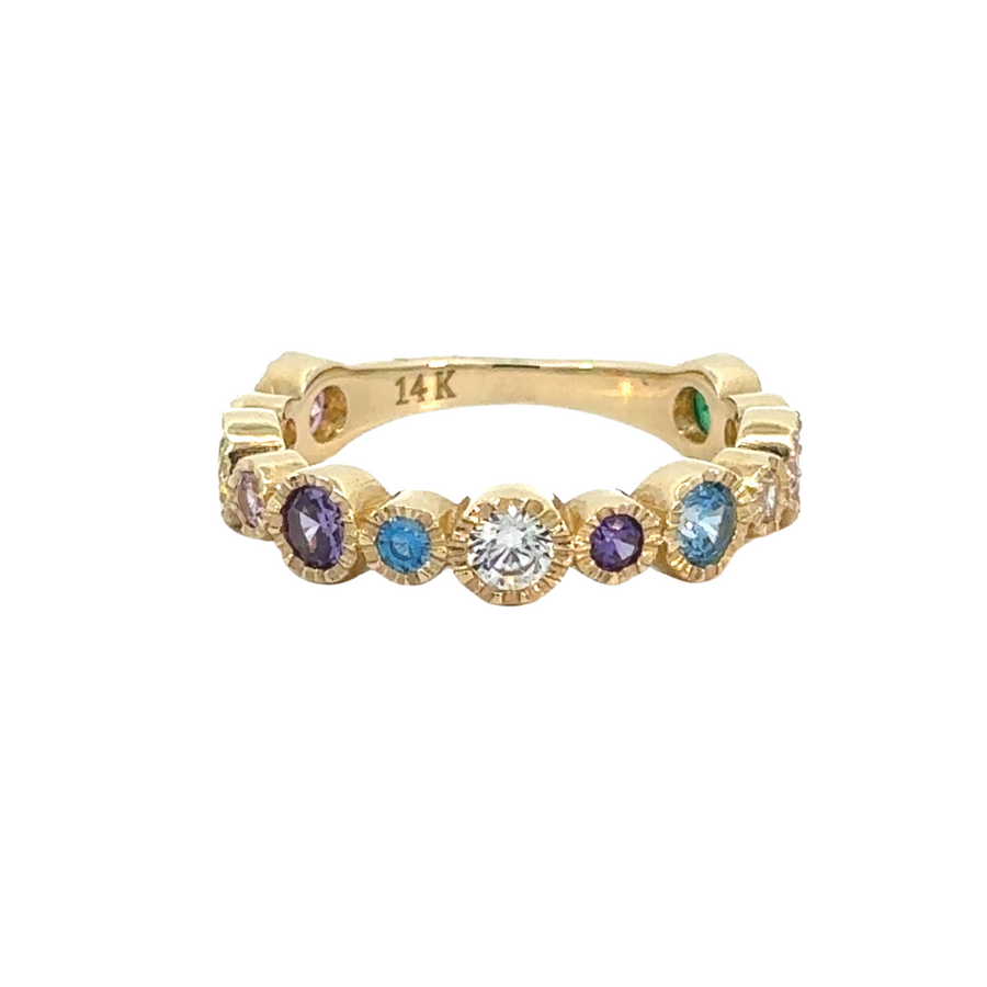 Close-up of 14k gold ring with multi-colored CZ stones on white background