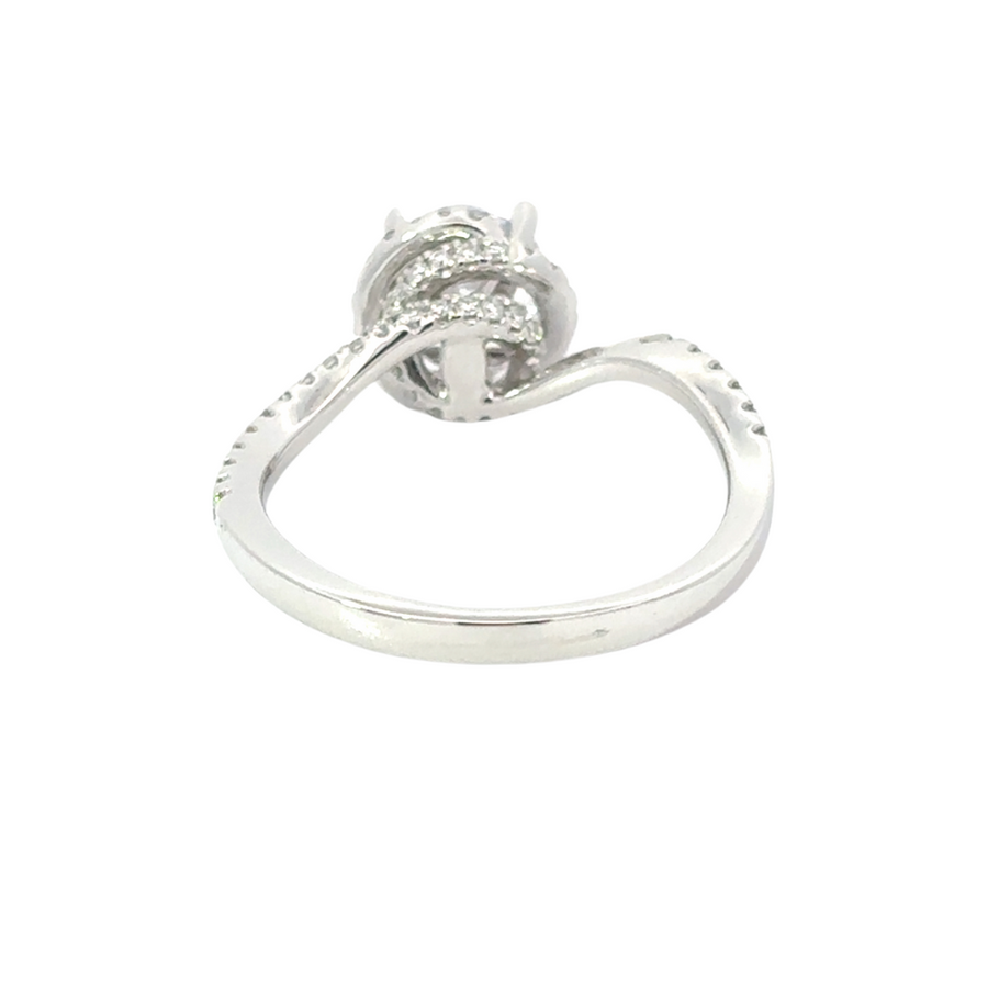 Woman’s hand wearing 14k gold ring with CZ and diamonds