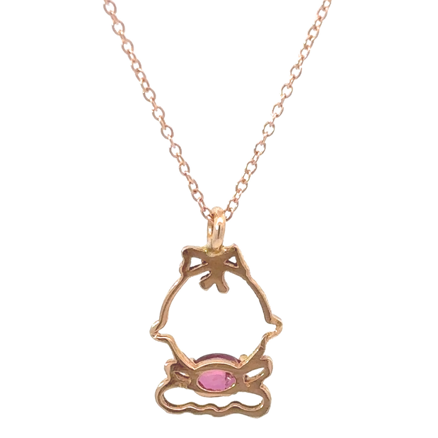 Rose gold necklace with delicate charm on model