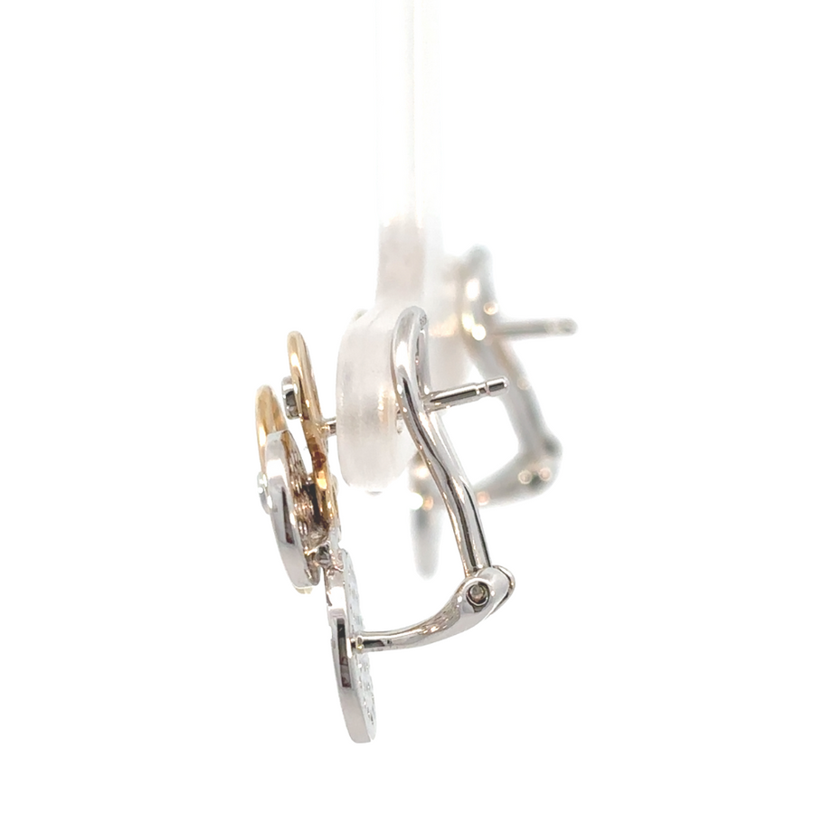 Side angle of gold ring showing detailed band and diamond setting
