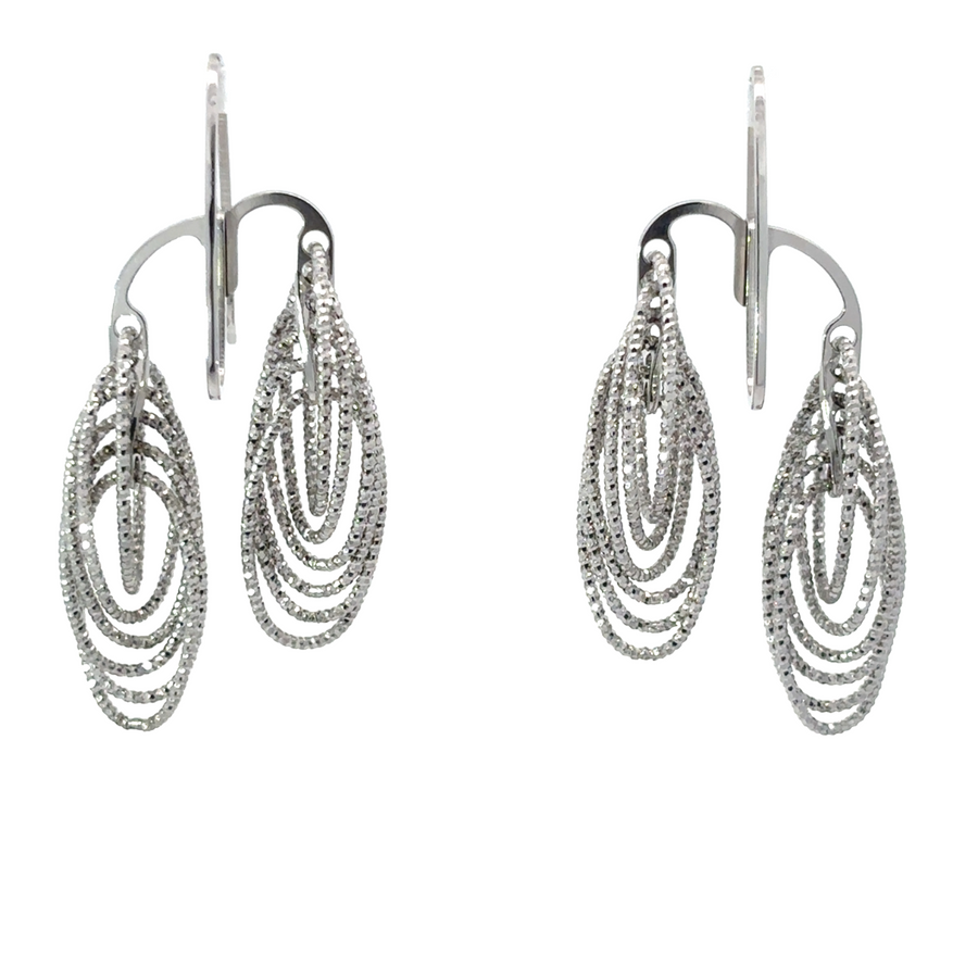 Close-up of sterling silver diamond-cut circle earrings