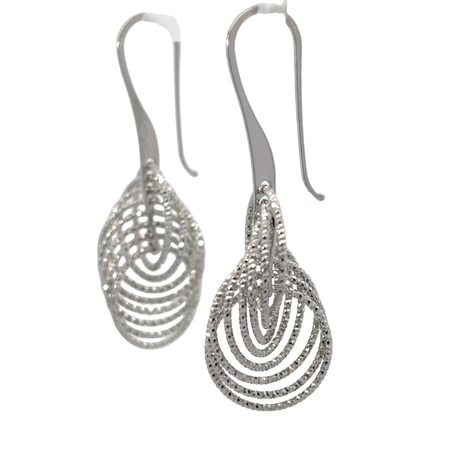 Close-up of diamond-cut details on 925 silver earrings