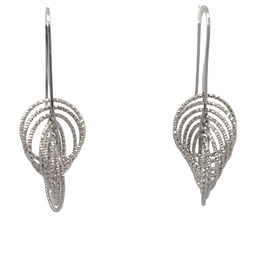 Silver diamond-cut "Swiri" earrings on white background