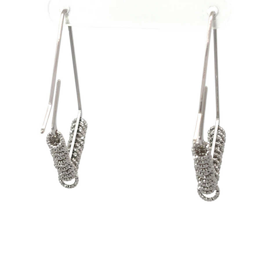 Woman wearing classic silver earrings with casual outfit