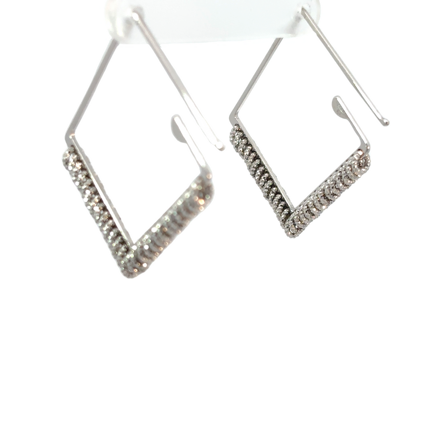 Timeless silver earrings displayed on jewelry holder