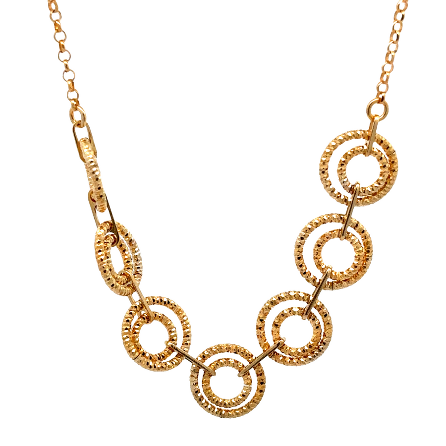 Silver necklace with center circle pendant on white background