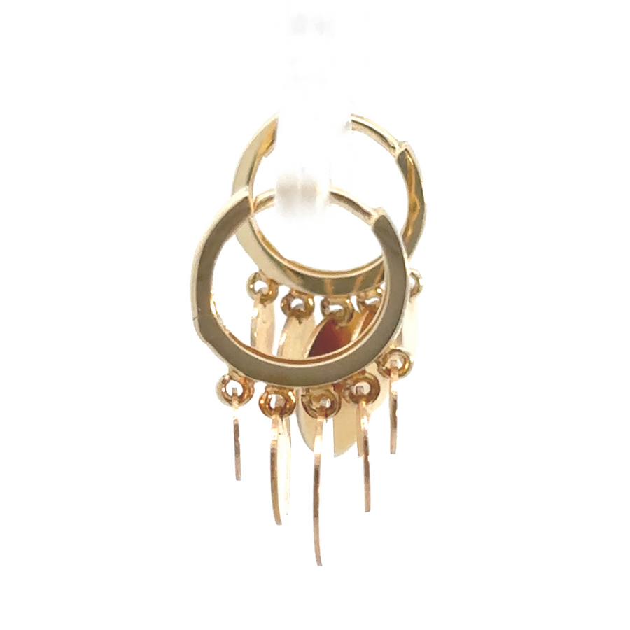 Close-up of multi circle gold huggie earrings for women