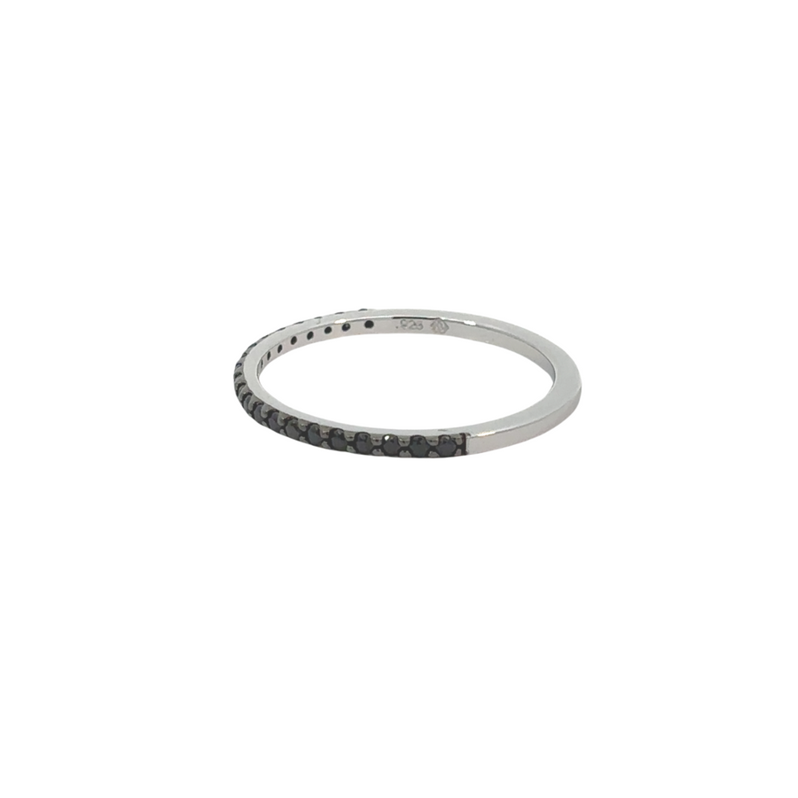 Side view of thin black silver ring showcasing polished finish