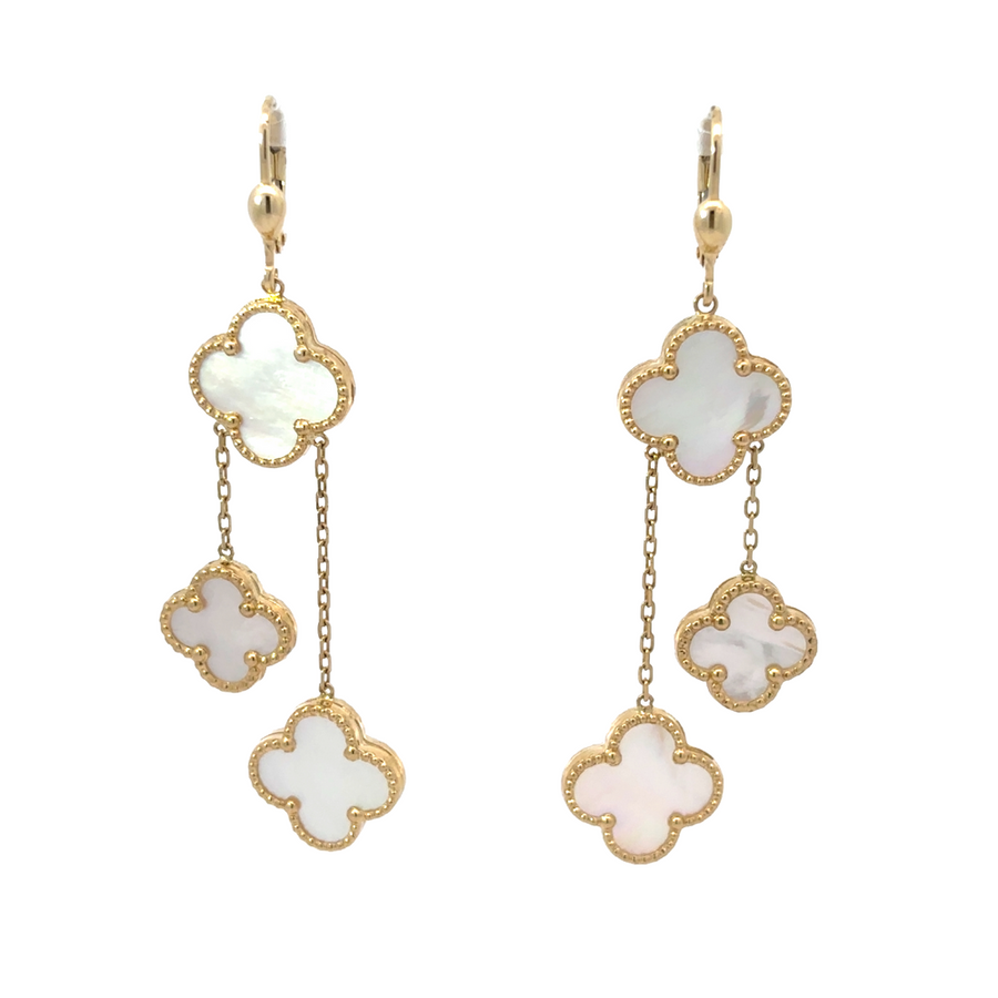 Close-up of timeless 14k gold earrings on white background