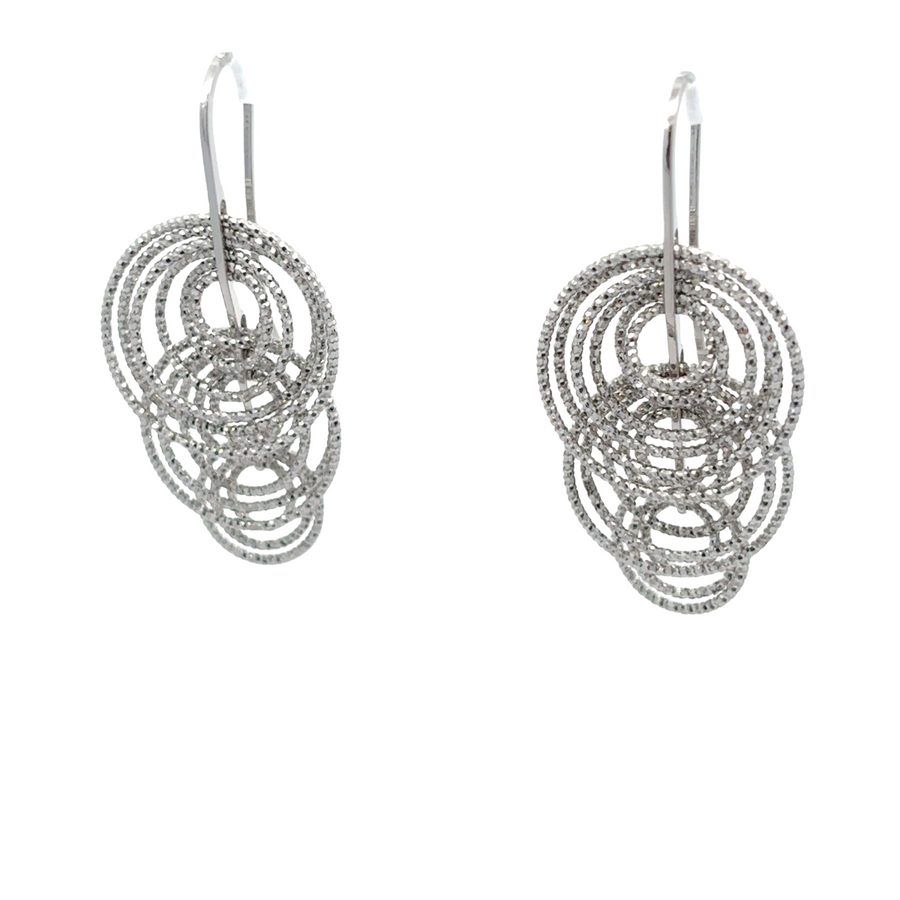Timeless diamond-cut silver earrings on white background