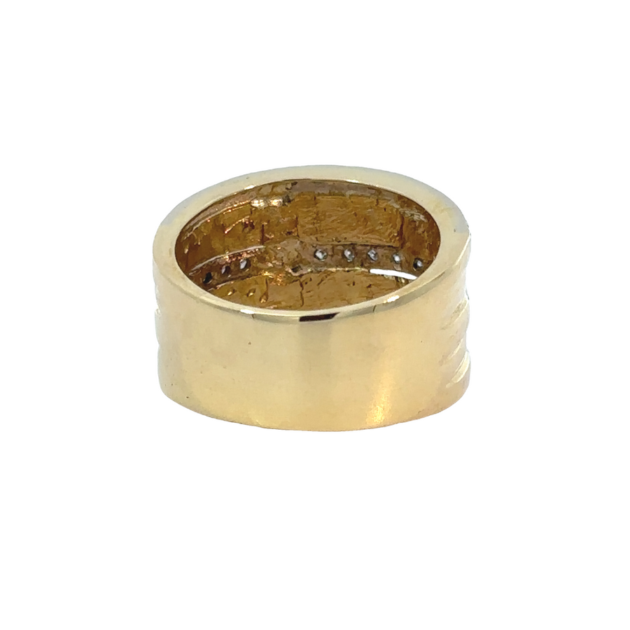 Side view of ring showing dual-tone gold and diamond accents