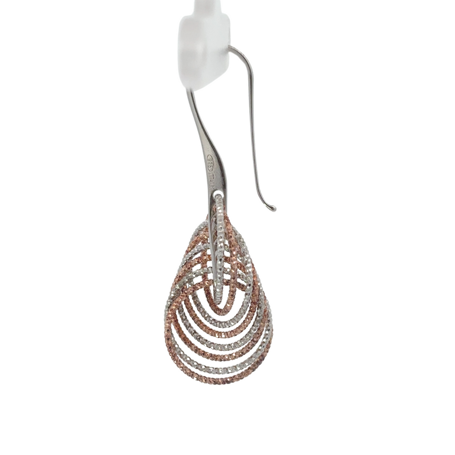 Elegant dual-tone 925 silver earrings displayed on a white background