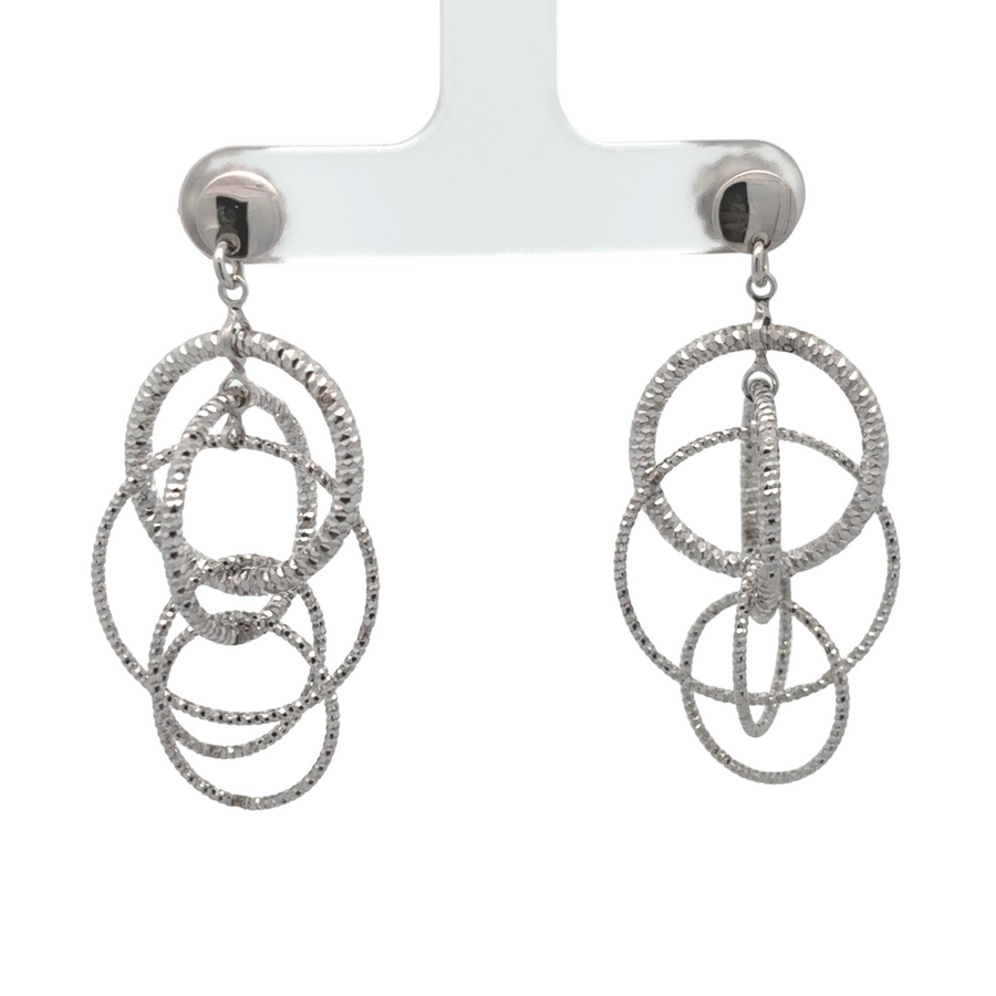 Two-toned silver earrings displayed on white background