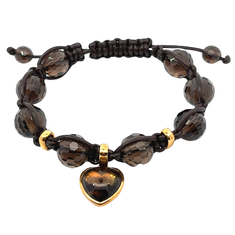 Unisex bracelet crafted from 18k gold and brown onyx with heart charm