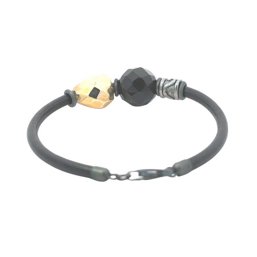 Model wearing leather necklace and bracelet set