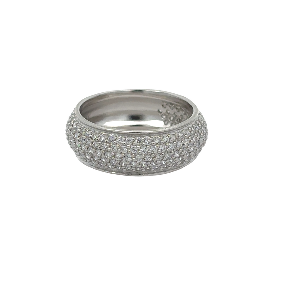 White silver ring on neutral fabric background