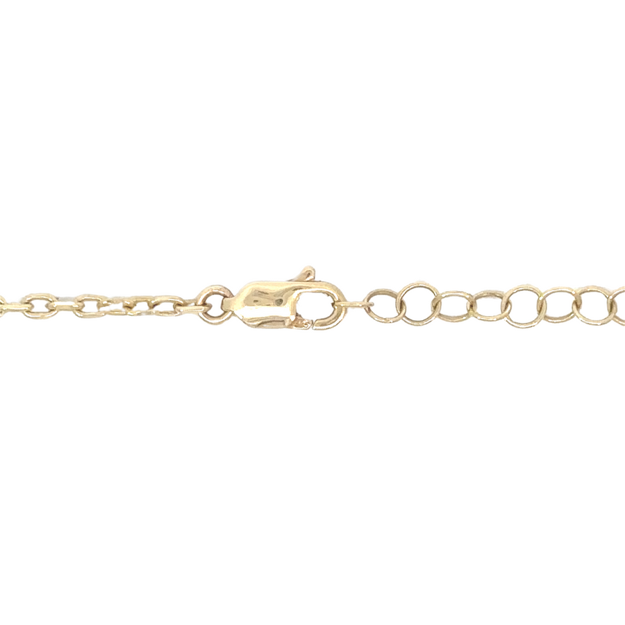 Elegant 14k gold necklace featuring green stones and gold detail