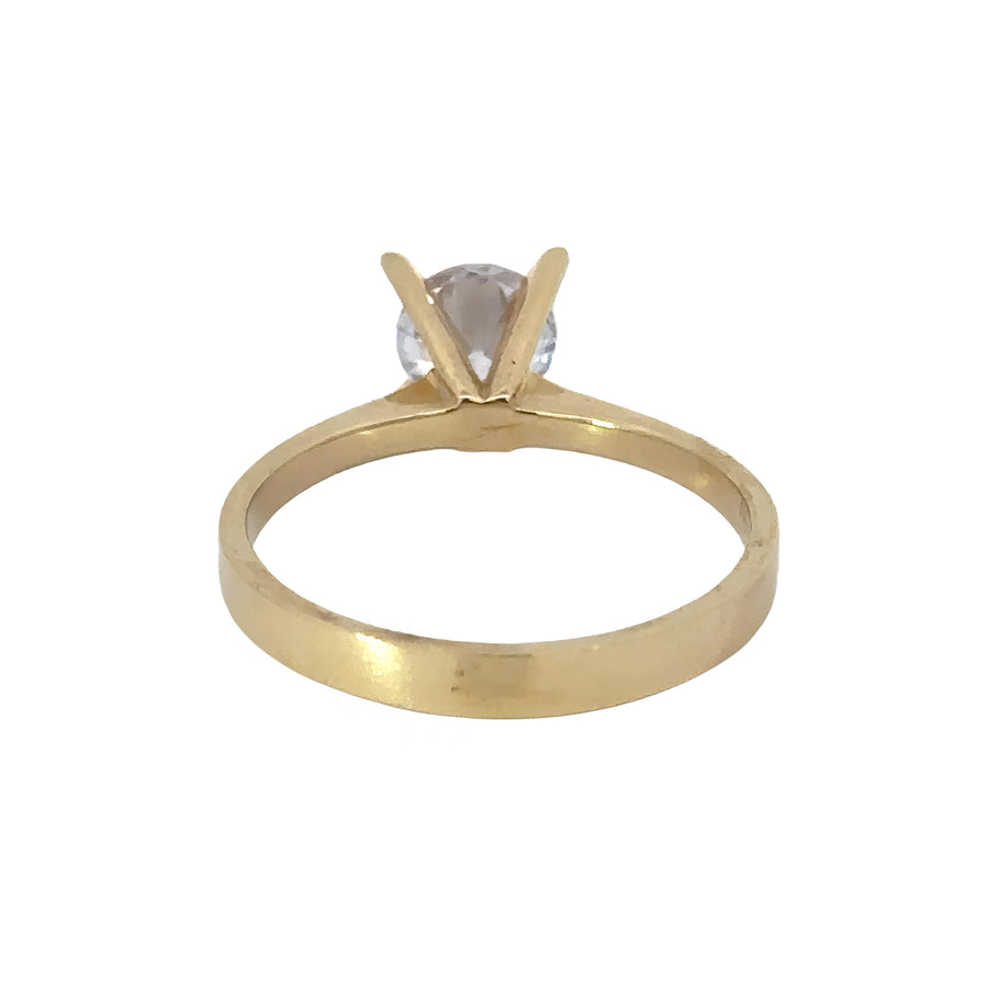 Sleek 14k gold band featuring a single sparkling gemstone