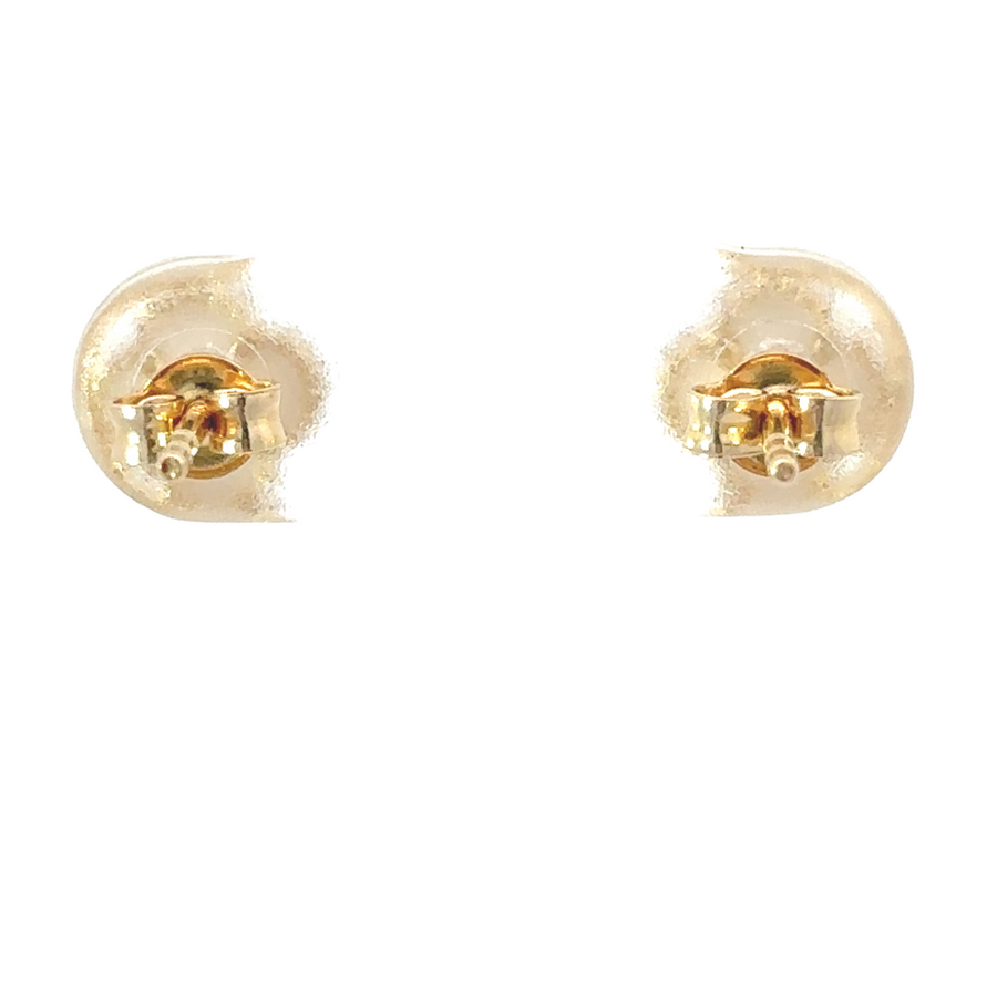 Woman wearing XXS 14k gold earrings in second piercings