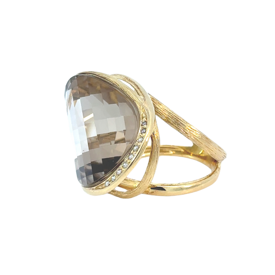 Diamond-accented yellow gold ring styled with neutral tones