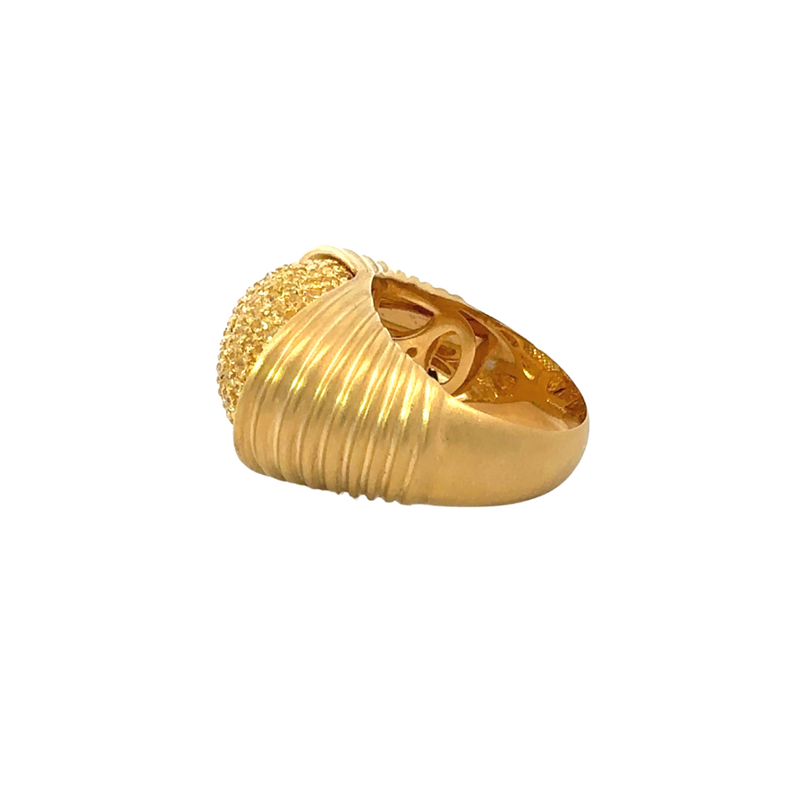 Women’s size 6 gold ring with diamonds on white background