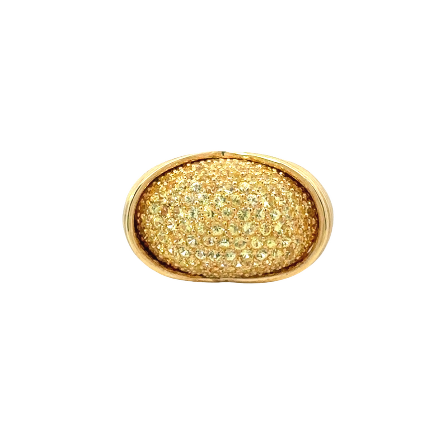 18k yellow gold ring with sparkling diamonds on soft fabric