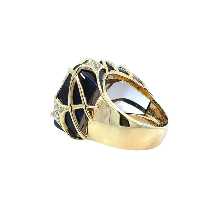 Side angle showing smoky quartz set in yellow gold with diamond accents
