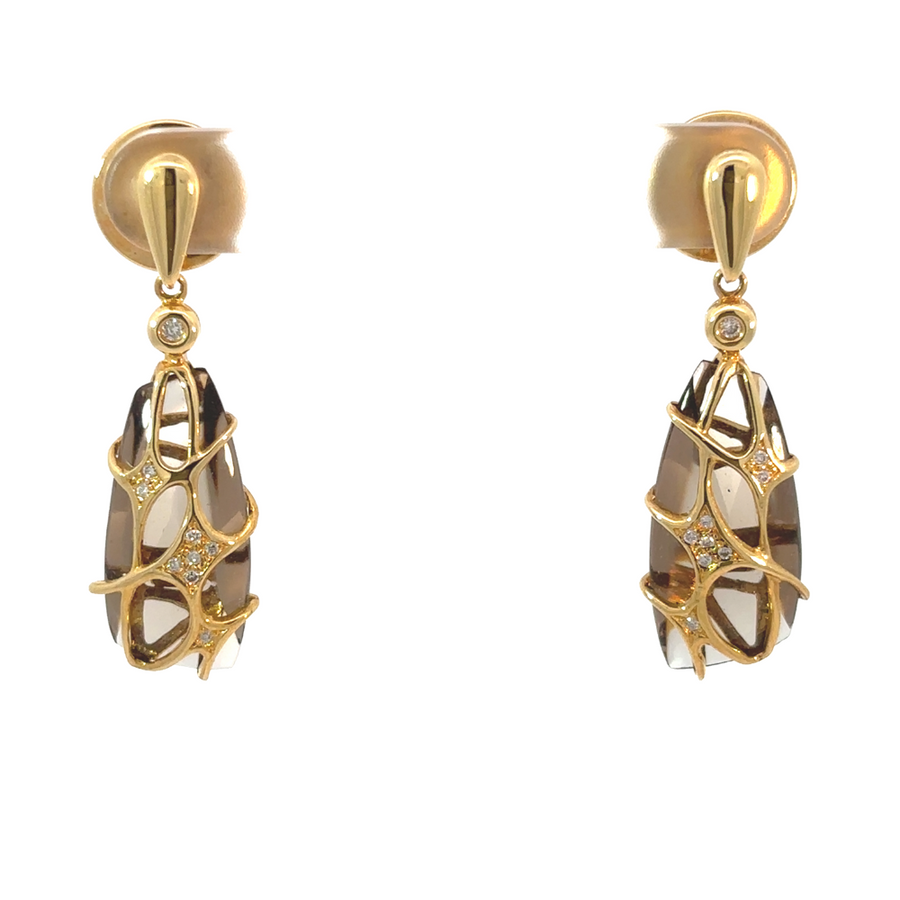 Close-up of 18k yellow gold earrings with smoky quartz and diamond accents