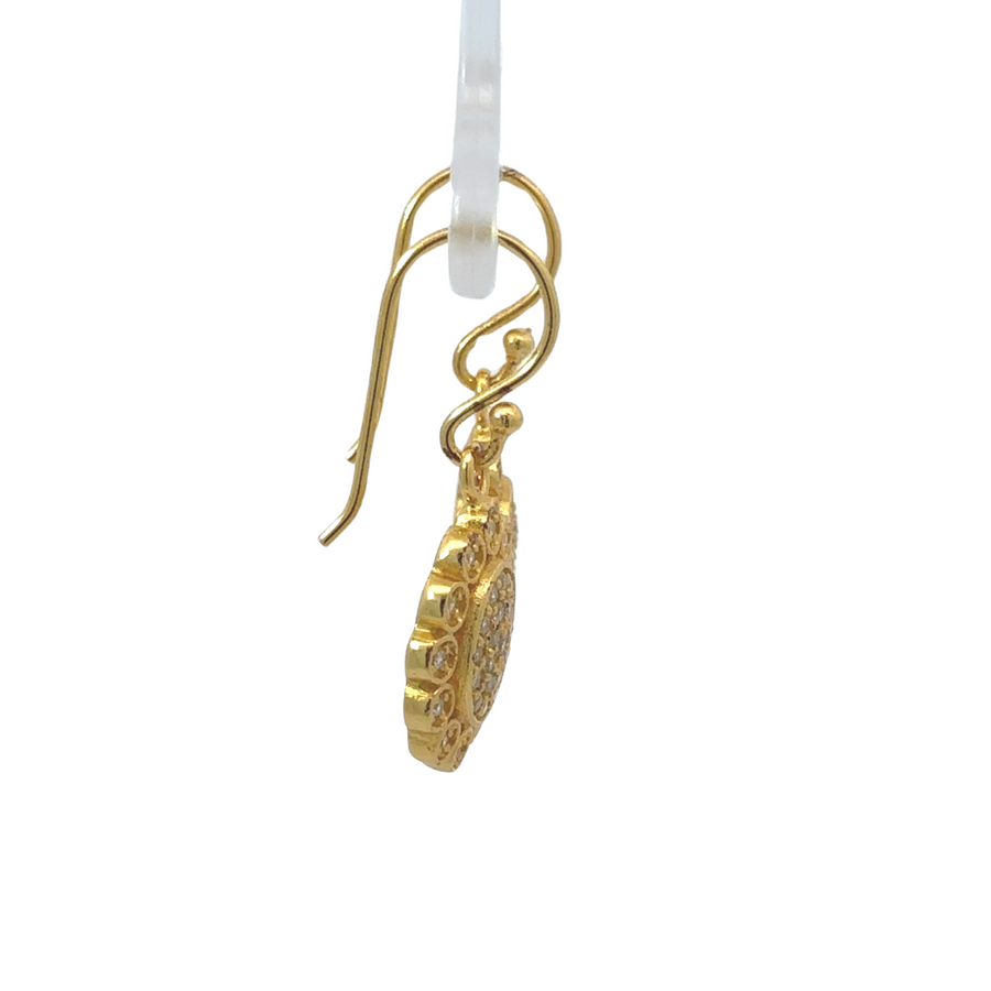 Elegant floral earrings crafted in yellow gold over silver