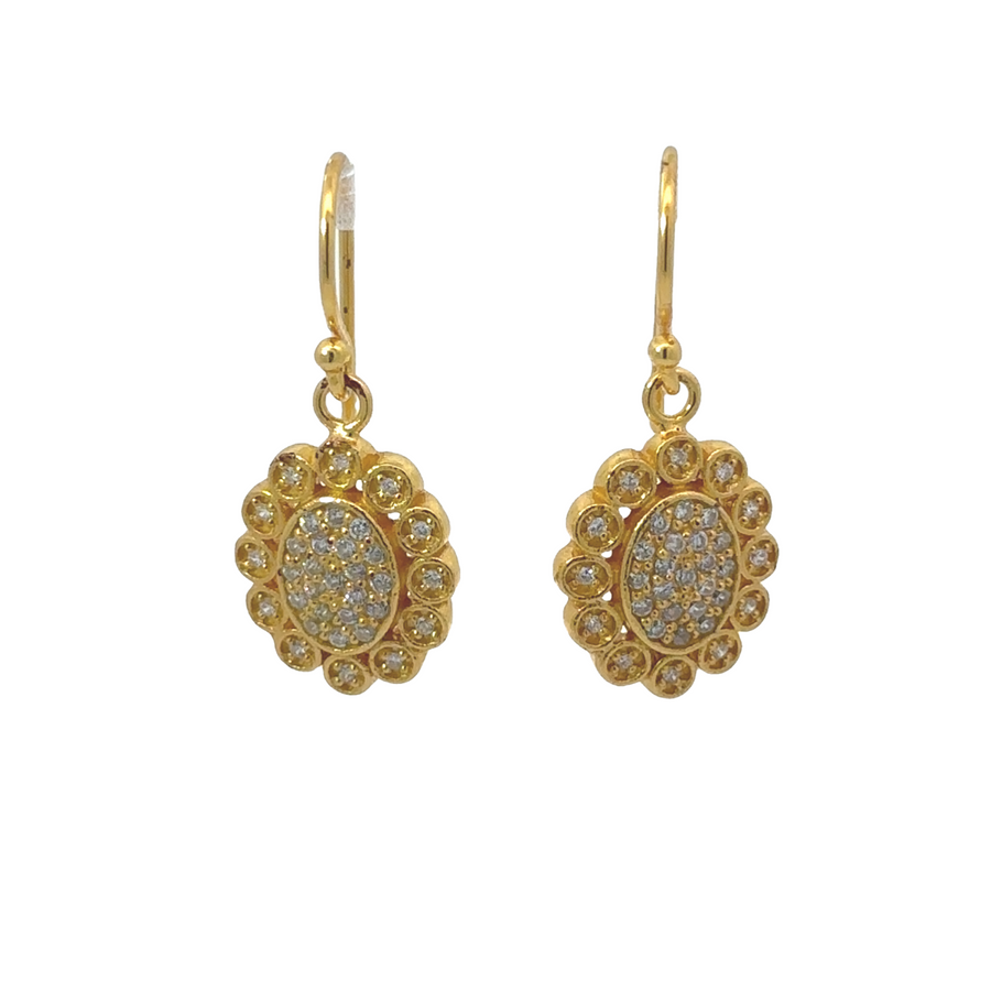 Yellow gold flower earrings displayed on white background