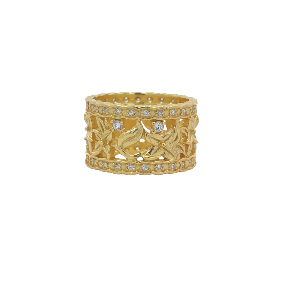 Close-up of yellow gold-plated silver ring with floral and leaf design