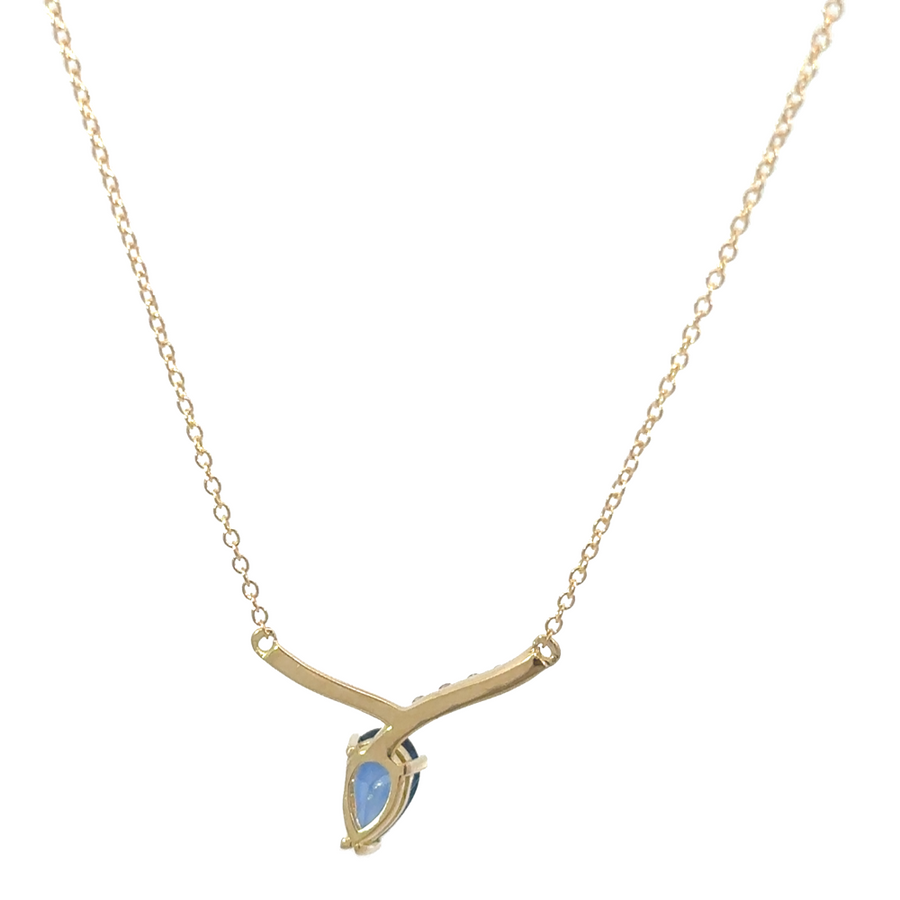 Elegant gold necklace with blue sapphire stone